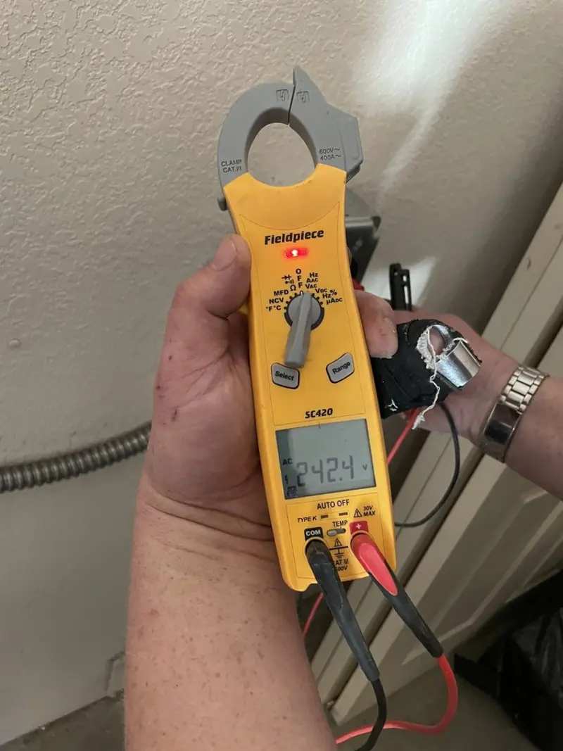 Voltage testing with clamp meter during Outlet Installation in Central